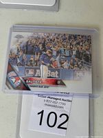 Front of 2010 Topps Chrome baseball card showing Jose Bautista executing a bat flip during a game, with crowd background and Toronto Blue Jays logo.