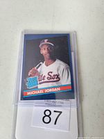 Front image of Michael Jordan baseball card showing him in a white 'Sox' uniform with a 'Rated Rookie' badge.