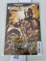 Photo of the comic book Star Wars The Mandalorian #2 showing cover art, Marvel branding, and issue number.