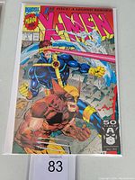 Front cover of X-Men #1 comic book showing Cyclops and Wolverine in action poses, colorful and clean cover.
