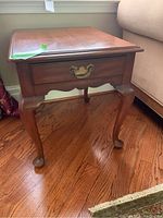Rectangular wooden end table with dovetailed drawer and cabriole legs, polished wood finish, antique brass handle.