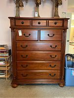 Front view of entire highboy dresser showing overall condition and drawer arrangement