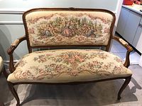 Front view of the loveseat showing frame, seat and backrest upholstery