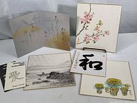 Overview of all five Kampa Harada art pieces arranged flat, showing variety of artwork styles including florals, calligraphy, landscape and butterfly.