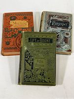 Set of three vintage embossed hardcover books: Milton (1884), Bryant (1887), and Life of Boone (1884) shown together