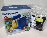 Discovery Kids Art Tracing Projector box with projector and girls hooded dress glove set in sealed plastic bag