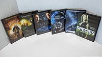 Photo showing 6 DVDs in the lot: Legend, Van Helsing, Skulls, Final Destination 3, Cerberus, Species.