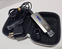 No!No! hair removal device with charging adapter and clear protective cover inside black zippered case, showing item condition and included accessories.