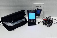 Ultima 20 TENS machine kit displayed with case, electrode wires, and manual.