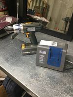 Mastercraft Maximum 18V cordless drill with battery attached and charger unit on table