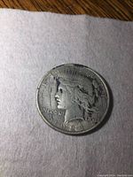 Obverse side of the 1924 US Peace silver dollar showing Lady Liberty profile with date and inscriptions.