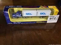 OCL Big Rigs semi-truck diecast model in original display box, showing front and side of packaging and item.