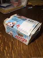 Box with branded Upper Deck MVP NHL hockey card artwork and a few unopened empty packs visible on top