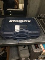 Closed hard plastic case with Mastercraft branding and a lot sticker on the front.