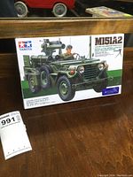 Front box view of the Tamiya M151A2 military jeep model kit showing box art with detailed model image and branding.