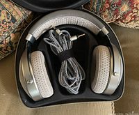 Headphones and braided cable inside black zippered case