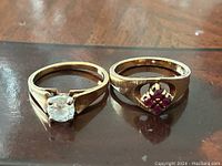 Front view of both rings side by side on table surface