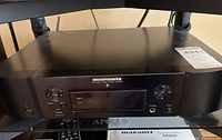 Front view of Marantz NA6006 network audio player showing display, control buttons and branding