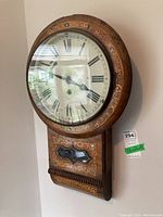 Front view of entire clock mounted on wall