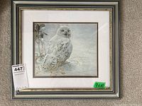 Full view of framed and matted print featuring a snowy owl in a winter setting with silver frame and white mat accented by gold liner, green '9x10' size sticker visible.