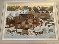 Framed limited edition print 'Pages Bake Shoppe' depicting a winter village scene with horse carriages and a mill building.