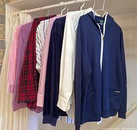 Photo showing all 8 Ralph Lauren shirts on hangers, including dress shirts and hoodie