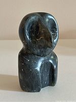 Front angled view showing overall shape, beak and body carving