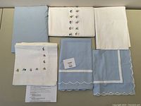 All linens and pillowcases laid out on table for overview