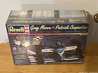 Box of Revell model kit featuring Greg Moore and Patrick Carpendier racing car.