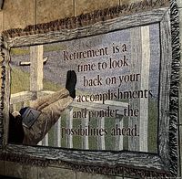 Woven retirement blanket throw laid flat showing full design and text.
