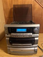 Front view of the entire Teac DC-D2831 hi-fi system showing turntable, control panel with display and buttons, CD and cassette compartments.