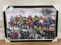 Full view of framed print with superheroes sitting on steel beam.