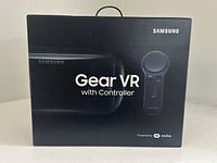 Front view of the product box showing the Samsung Gear VR headset with controller and branding details.