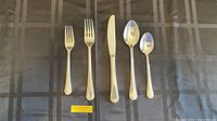Close up image of individual pieces showing fork, knife, spoons