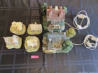 Photo showing two larger houses with cords and greenery details from above