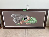 Full view of the framed painting showing the ballerina and swan on a brown background.