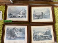 Four framed Quebec scene prints arranged in two rows on a carpet, showing rustic landscapes and town scenes with muted colors.
