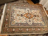 Full view of rug showing overall design, central medallion and border