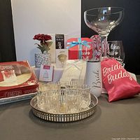 Full set of bridal party items arranged on table, clearly shows all main items including cups, photo album, gift box, fan, flower, and keepsakes