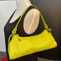 Kenneth Cole lime green leather handbag displayed on mannequin shoulder to show size and style