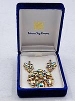 Vintage Sherman rhinestone brooch and matching earrings set displayed in a blue velvet Hudson's Bay Company box.