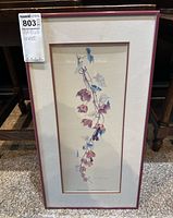 Framed art print showing botanical vine with blue and purple flowers and leaves, vertical format 12 x 22