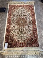 Full view of the prayer rug showing overall pattern and fringed ends