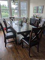 View showing eight chairs arranged around a dining table