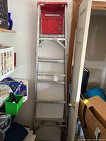 Full view of the 6 ft aluminum carpenter's ladder showing red top tray and five steps.
