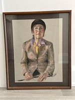 Full view of the framed portrait painting showing a woman in a brown jacket and hat seated against a neutral background.