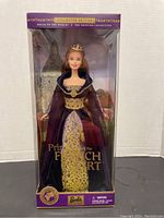 Front view of Barbie Collector Edition "Princess of the French Court" doll in original purple and gold packaging showing the doll inside with detailed gown and crown.