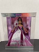 Front view of the boxed 2005 Holiday Barbie doll showing the full gown and box details