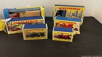 Group view of six Matchbox vehicles in original boxes showing two long-box semis and four shorter boxes