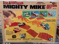 Front of original box showing vintage graphic of a child playing with Mighty Mike toy set with bridges and vehicles illustrated